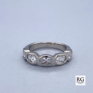 925 OVAL CZ BEZEL SET HALF ETERNITY BAND - 5MM <br/>M13552